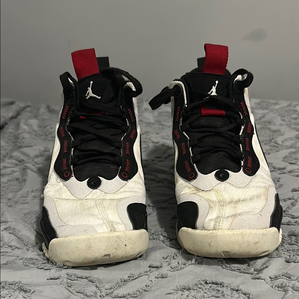 Jordan Black and White Athletic Shoes with Red Accents